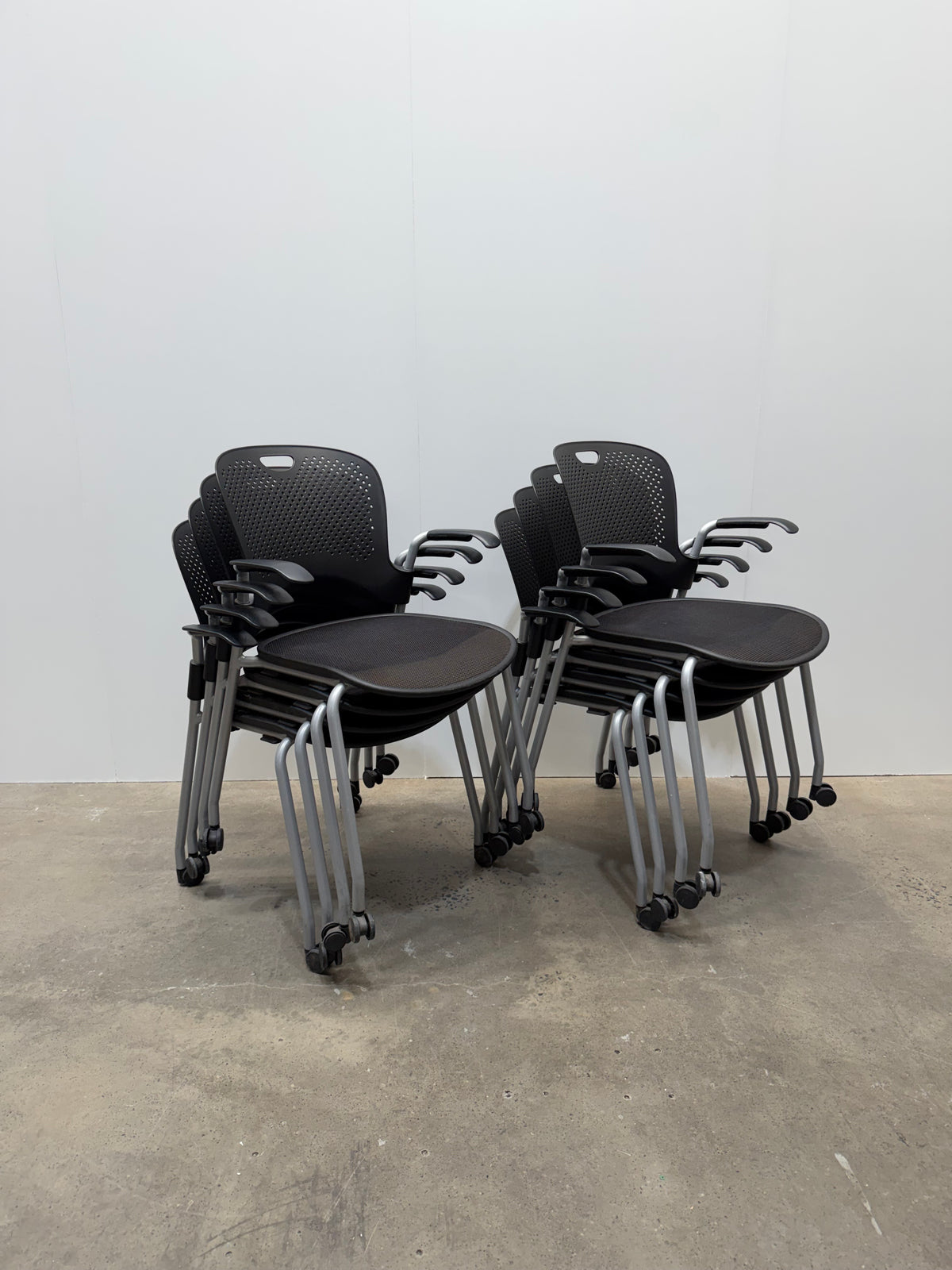 Herman Miller Caper Stacking Chair – Black Flexnet Seat, Fixed Arms, Castors – view 3 – pre-owned
