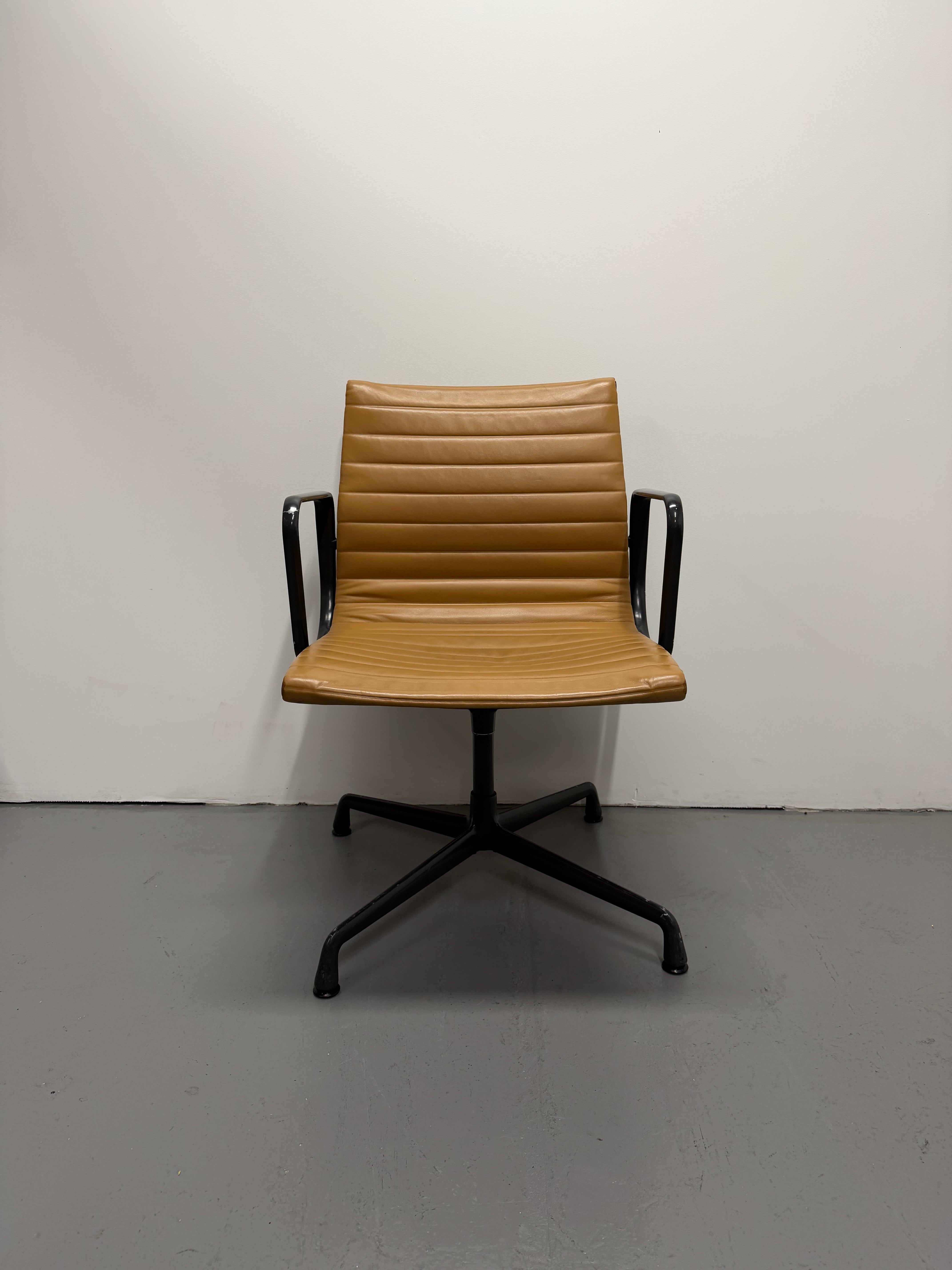 Eames Aluminium Group Low Back Chair - Tan Leather / Black Frame