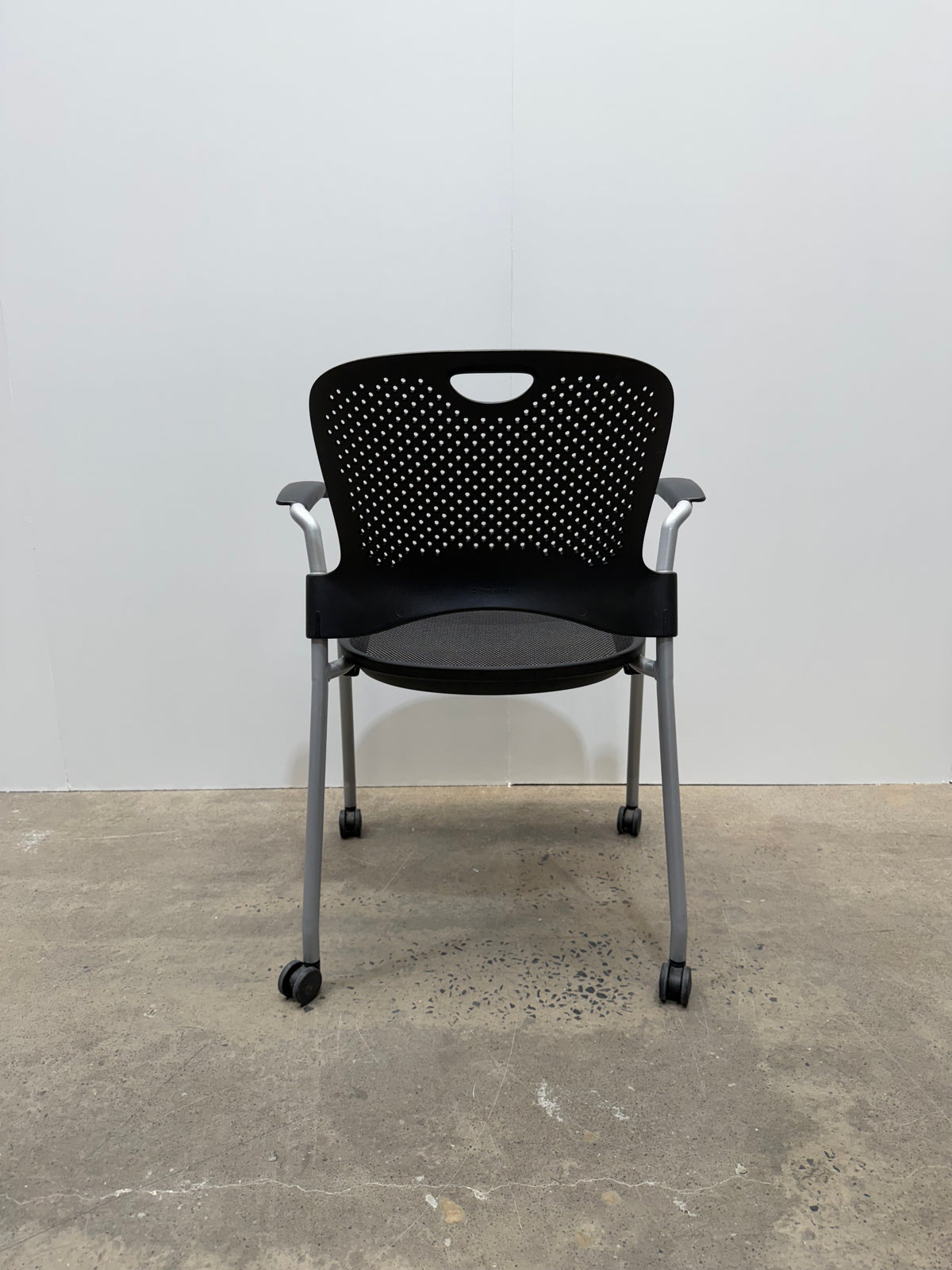 Herman Miller Caper Stacking Chair – Black Flexnet Seat, Fixed Arms, Castors – view 5 – pre-owned
