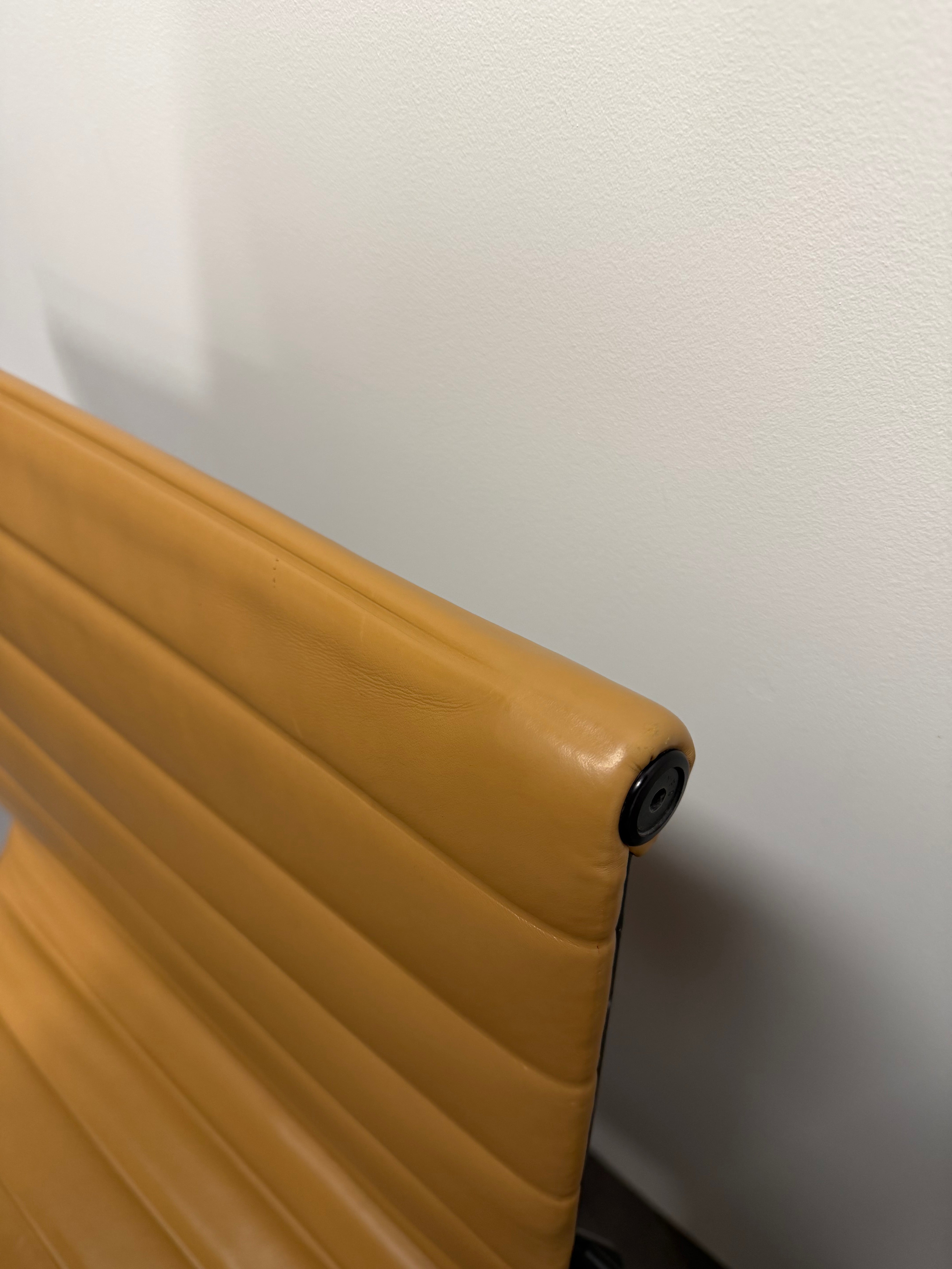 Eames Aluminium Group Low Back Chair - Tan Leather / Black Frame