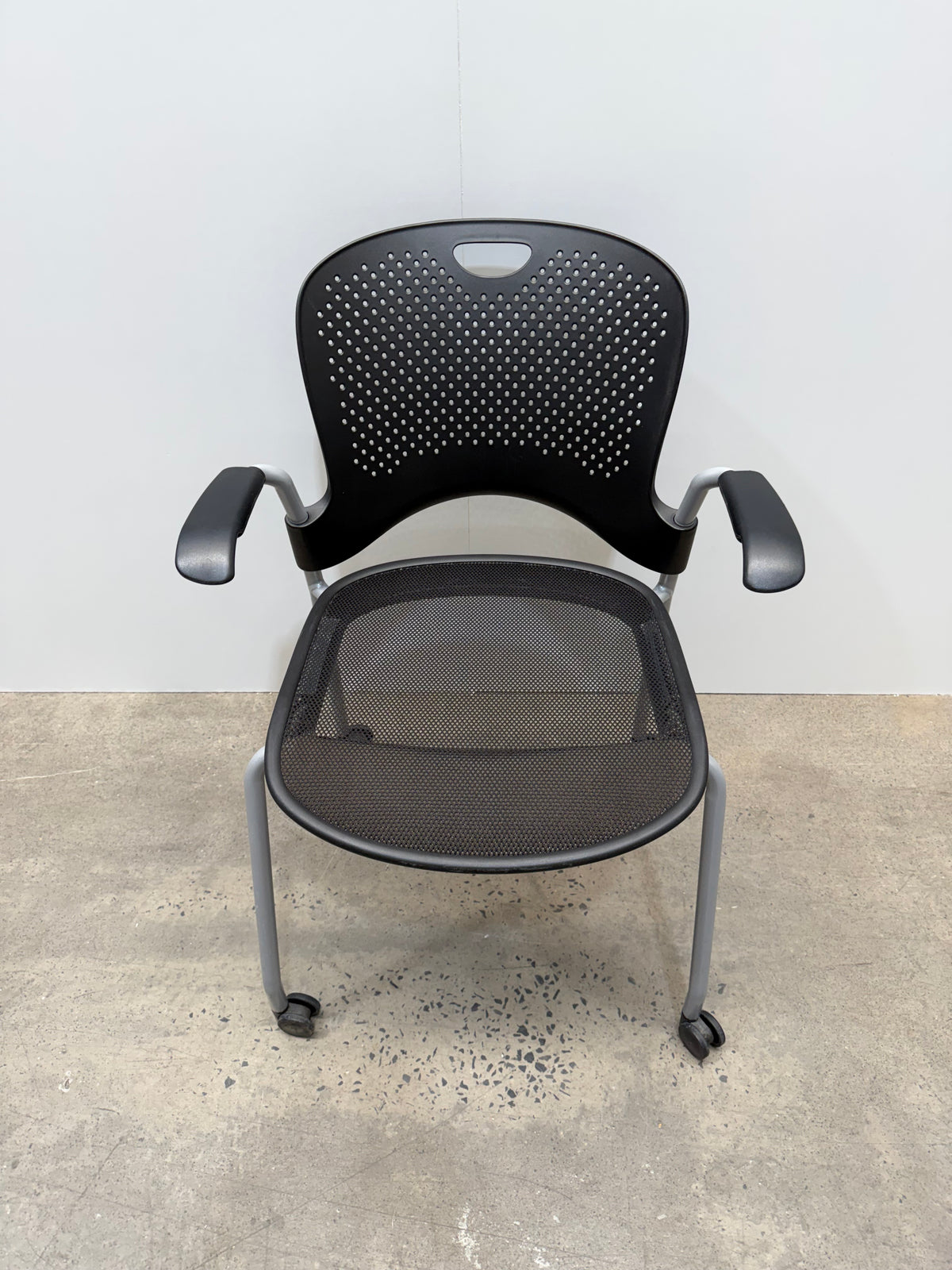 Herman Miller Caper Stacking Chair – Black Flexnet Seat, Fixed Arms, Castors – view 8 – pre-owned