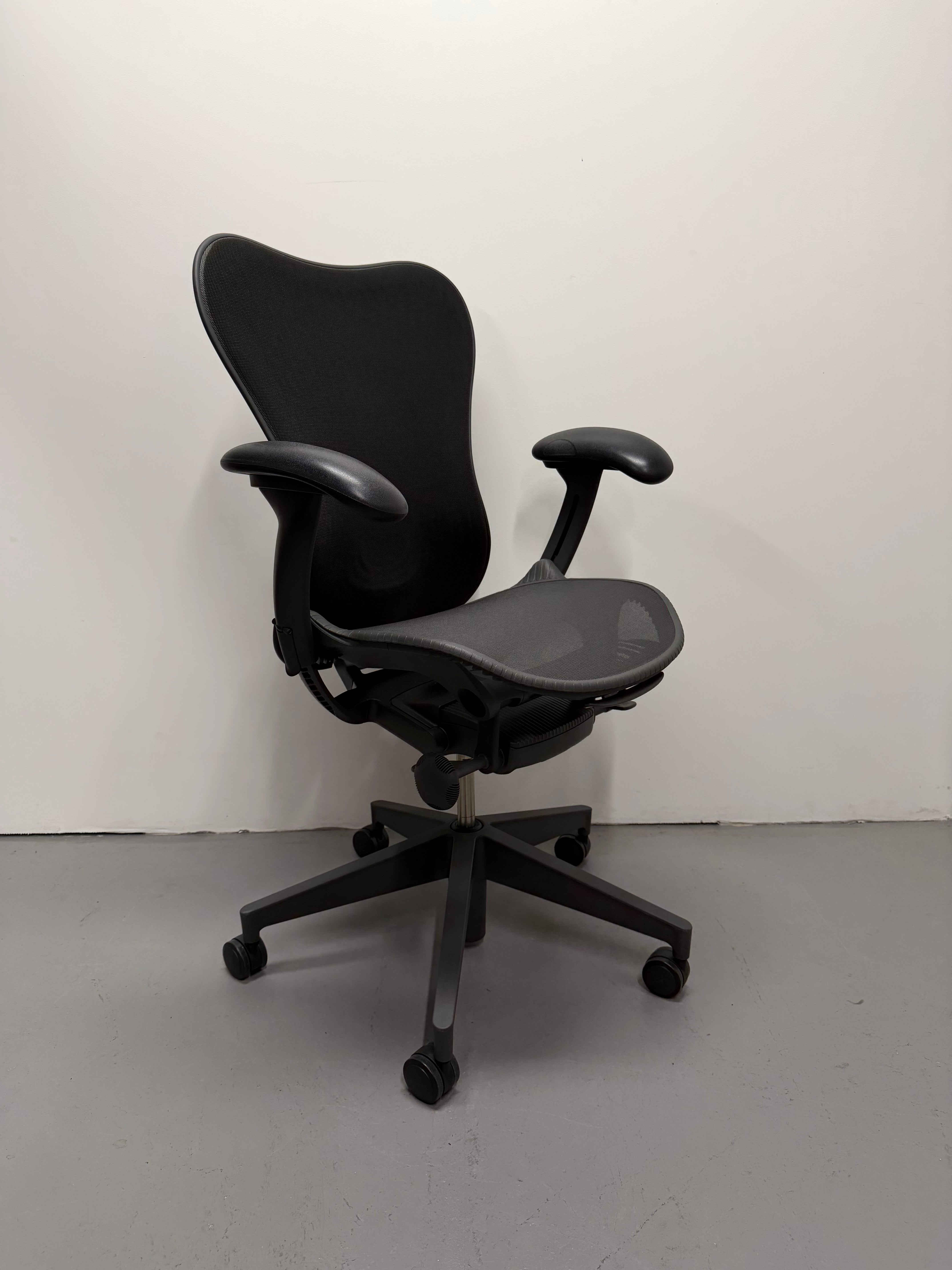 Black office chair on a plain white background